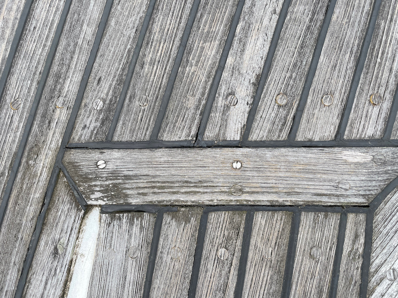 Teak deck with bad sealant