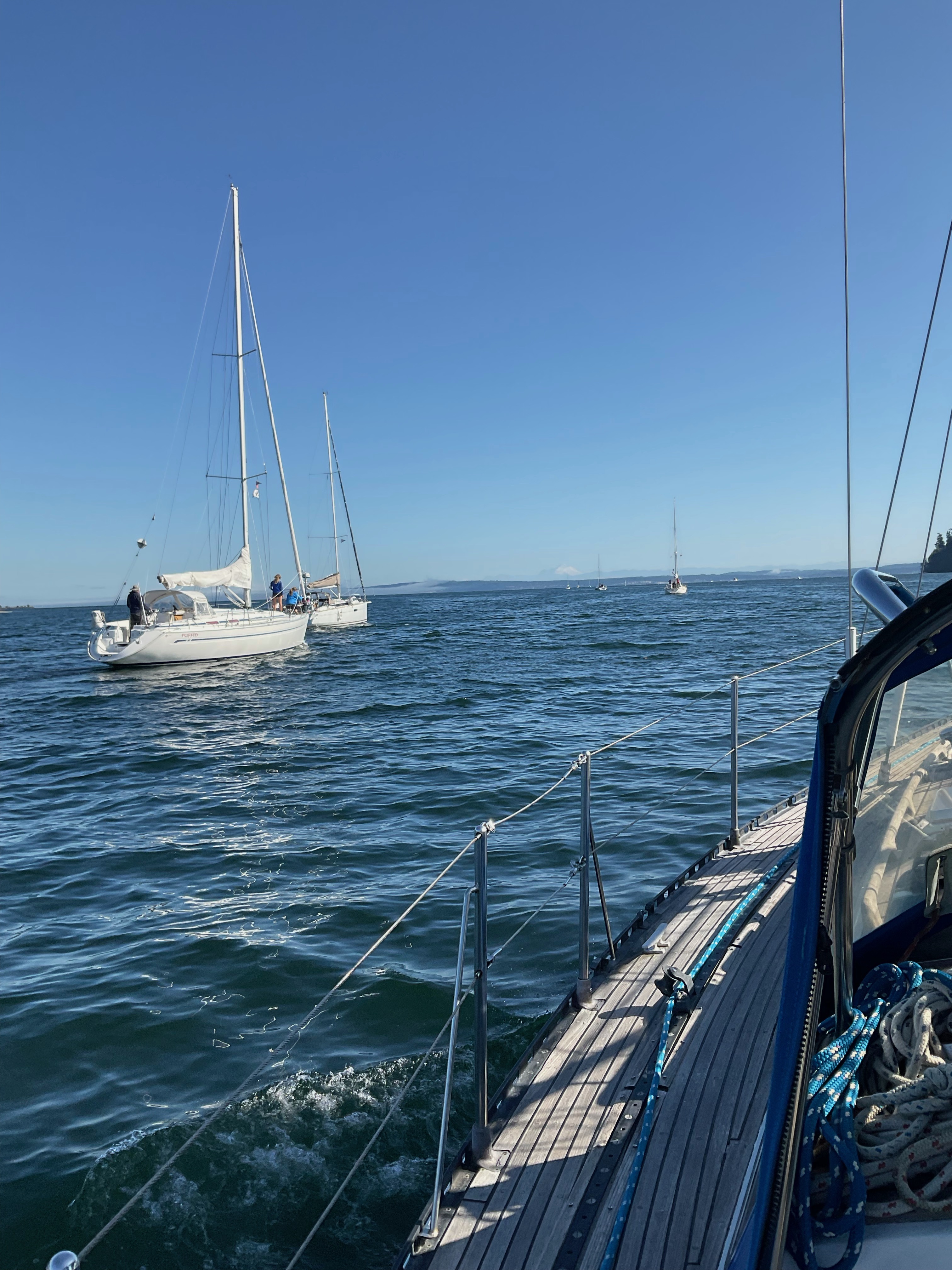 motoring out of Port Ludlow with a group of other sailboats