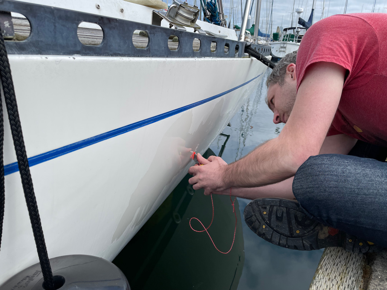 Shane scraping up the remaining adhesive