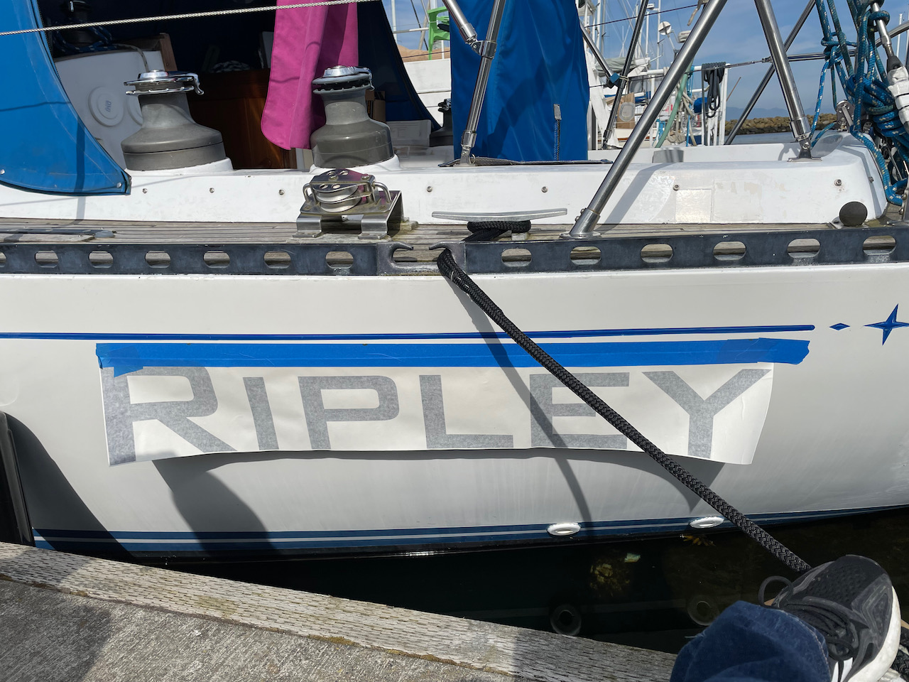 new vinyl letters taped onto the boat